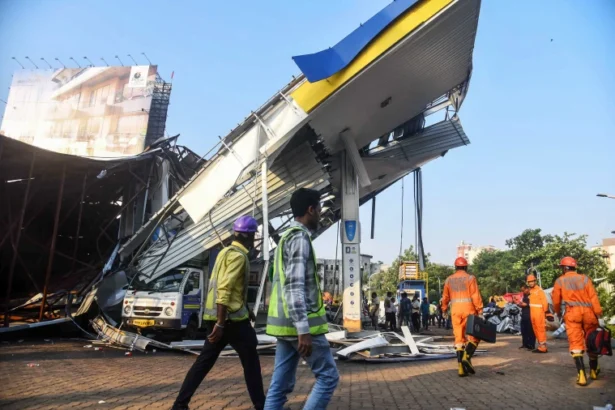 Rescue operations during the Mumbai storm news 2024, with emergency crews at the Ghatkopar site where a billboard collapsed, highlighting the severity of the storm's impact.