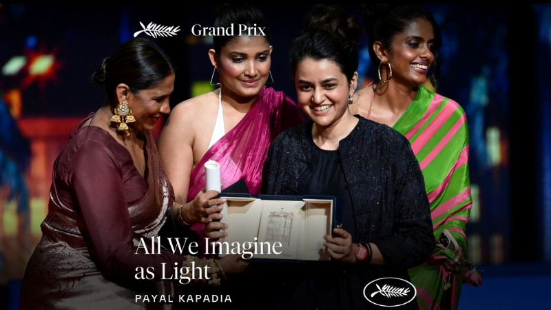 Payal Kapadia receiving the Grand Prix award at the 2024 Cannes Film Festival, smiling and holding the trophy on stage with the iconic Cannes backdrop.