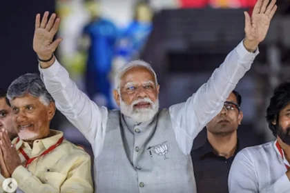 Narendra Modi waving to the public after winning the Lok Sabha elections, symbolizing the BJP's decisive victory and his influential leadership.