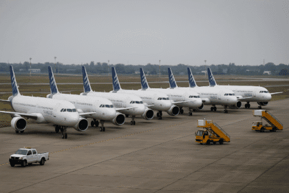 Multiple grounded Airbus A320 aircraft parked on an airport runway due to emergency recall