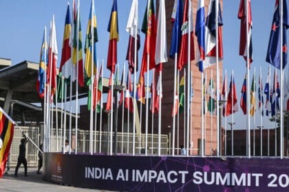 Wide view of the India AI Impact Summit at Bharat Mandapam in New Delhi, showcasing a global artificial intelligence conference with policymakers, tech leaders, and digital innovation displays.
