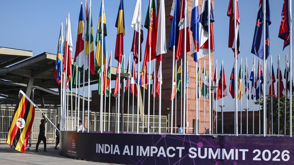 Wide view of the India AI Impact Summit at Bharat Mandapam in New Delhi, showcasing a global artificial intelligence conference with policymakers, tech leaders, and digital innovation displays.