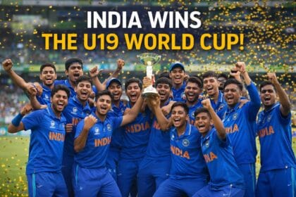Sooryavanshi takes India ahead. Indian Under-19 cricket team celebrating their World Cup victory on the field with the trophy, players in blue jerseys cheering after defeating England in the final.