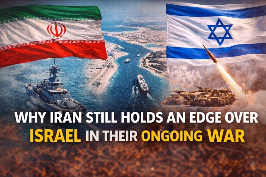 Why Iran Hasn’t Lost the War Yet illustrated with Iran and Israel flags facing each other over the Strait of Hormuz, showing oil tankers, missiles, and geopolitical tension during the ongoing Iran-Israel conflict.